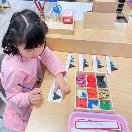 kid playing with shapes
