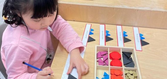 kid playing with shapes